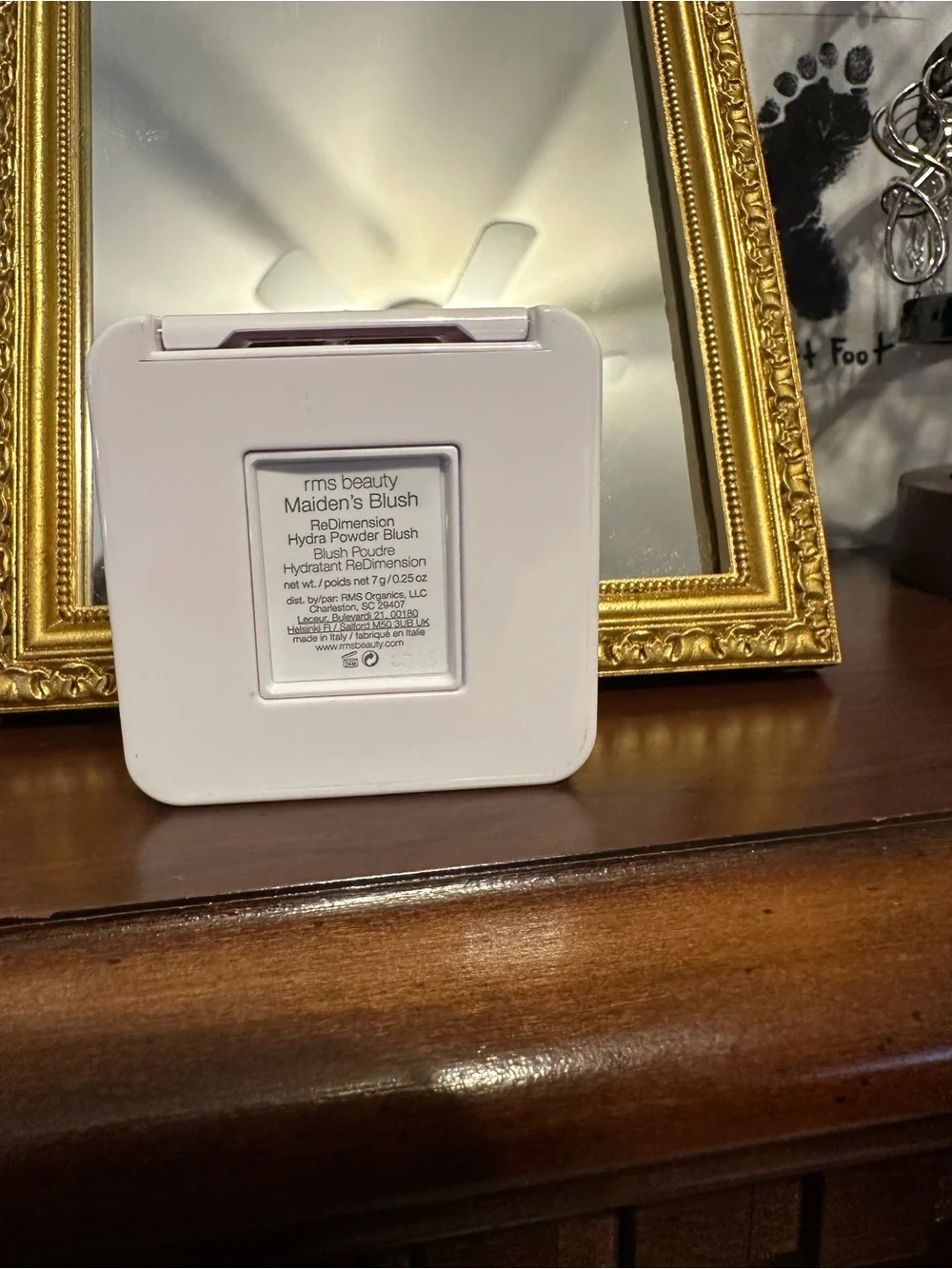 RMS Beauty compact in white with red logo